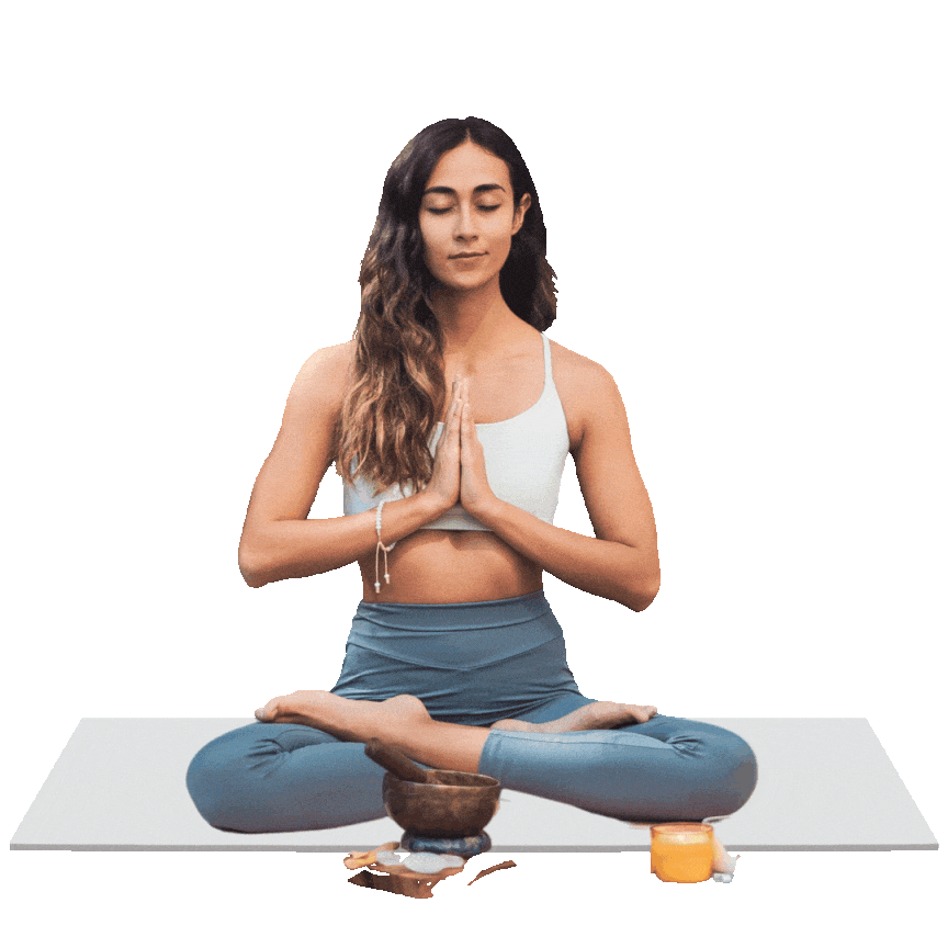 A serene woman practicing meditation in a wellness center, sitting cross-legged with hands in a prayer position. A singing bowl and candles symbolize holistic therapy and mindfulness.